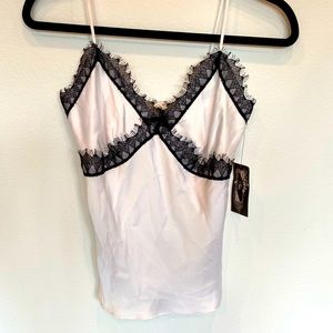 Silky white with black lace trim camisole.